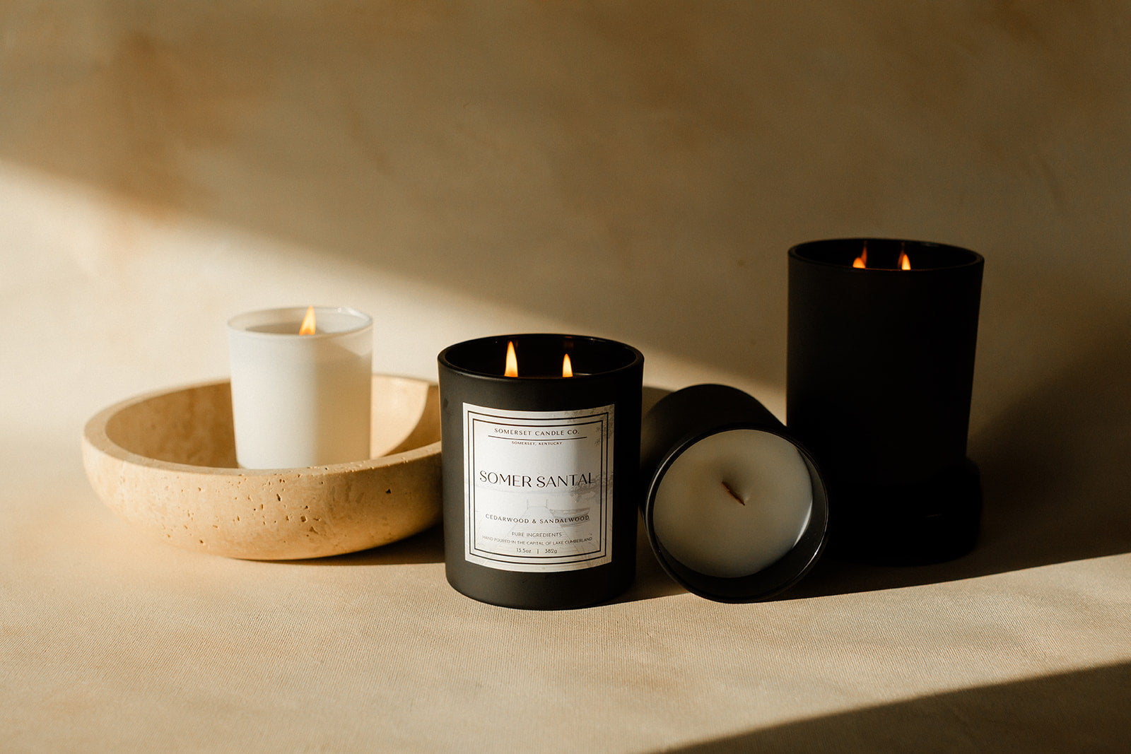 Somer Santal Black vessel candles in soft lighting