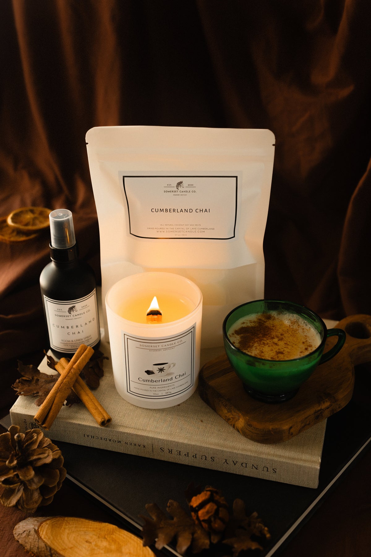 Image of Cumberland Chai Candle Lit, Room & Linen Spray, and package of Wax Melts